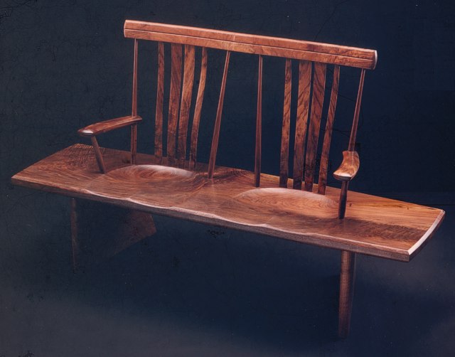 Walnut Bench Seat: single board seat with carved back & steam bent slats by Michael Elkan
